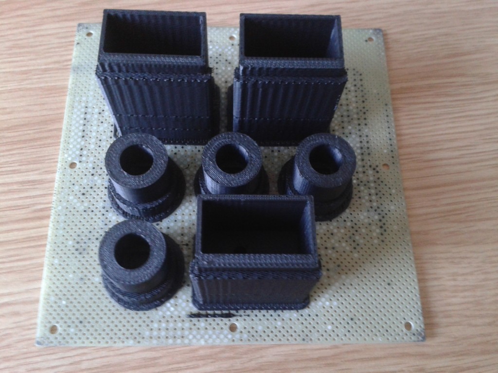 This is how the parts appear when first removed from the printer.  There support material to make sure the parts don't fall over or droop during printing